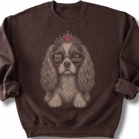 Cavalier King Charles Spaniel Mom Says I'm Perfect on a Dark Chocolate crewneck sweatshirt, shown flat