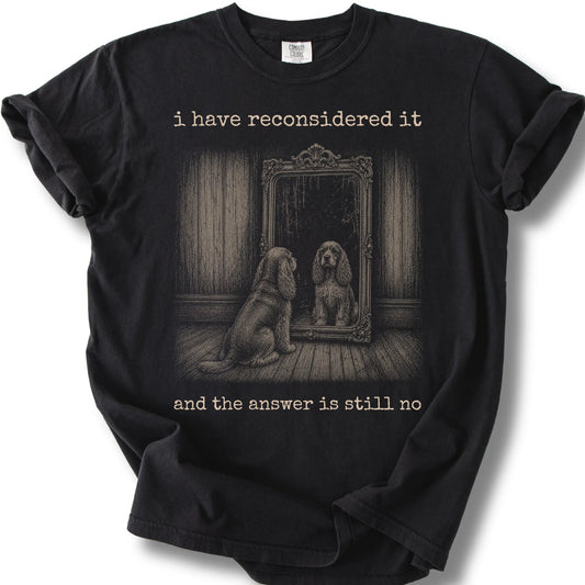 Antisocial Cocker Spaniel design on a Black Comfort Colors T-shirt, shown flat