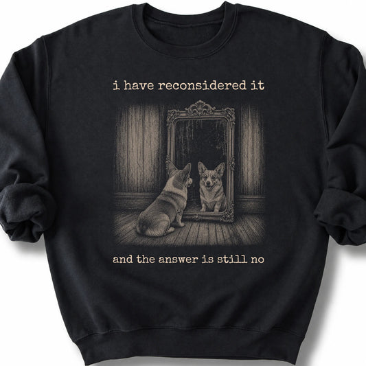 Corgi The Answer Is Still No on a Black crewneck sweatshirt, shown flat