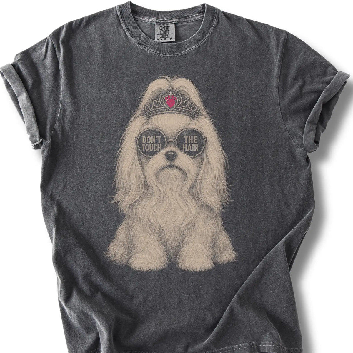 Pepper Maltese Don't Touch The Hair T-shirt laid flat on an outdoor wooden bench