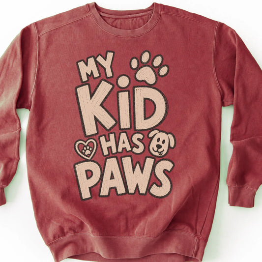 My kid has paws on a Crimson crewneck sweatshirt, shown flat