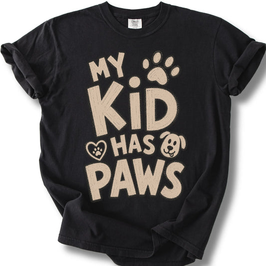 My Kid Has Paws design on a Black Comfort Colors T-shirt, shown flat