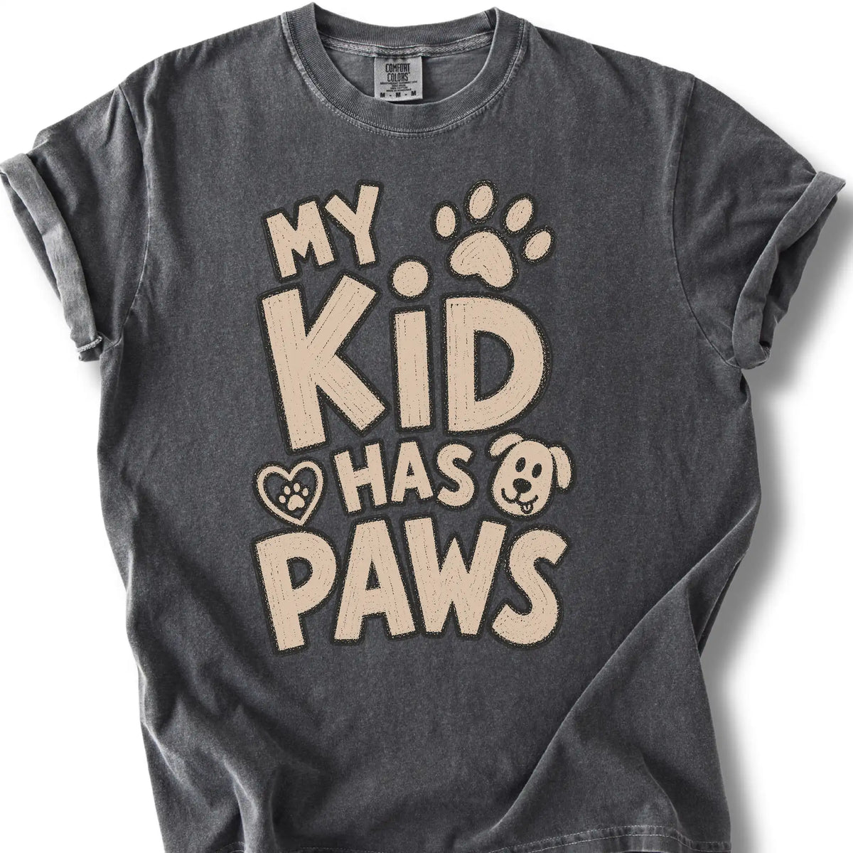 My Kid Has Paws design on a Pepper Comfort Colors T-shirt, shown flat