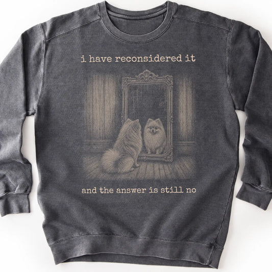 Pomeranian The Answer Is Still No on a Pepper crewneck sweatshirt, shown flat