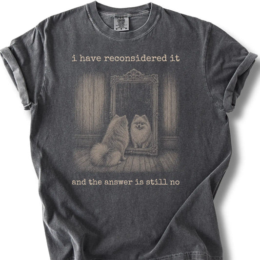 Antisocial Pomeranian design on a Pepper Comfort Colors T-shirt, shown flat