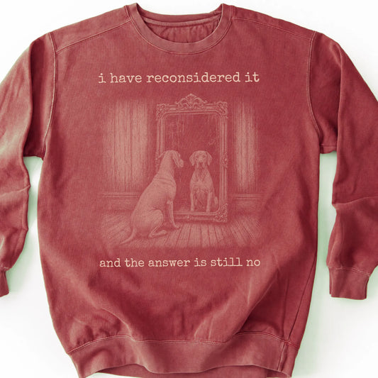 Weimaraner The Answer Is Still No on a Crimson crewneck sweatshirt, shown flat